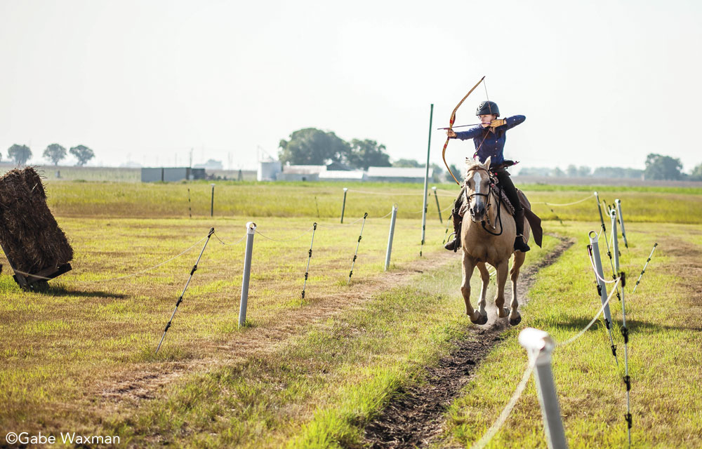 Gracie Waymer practicing mounted archery