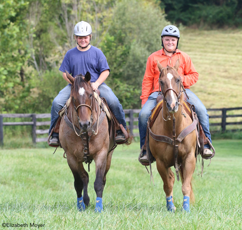 Two boys trail riding