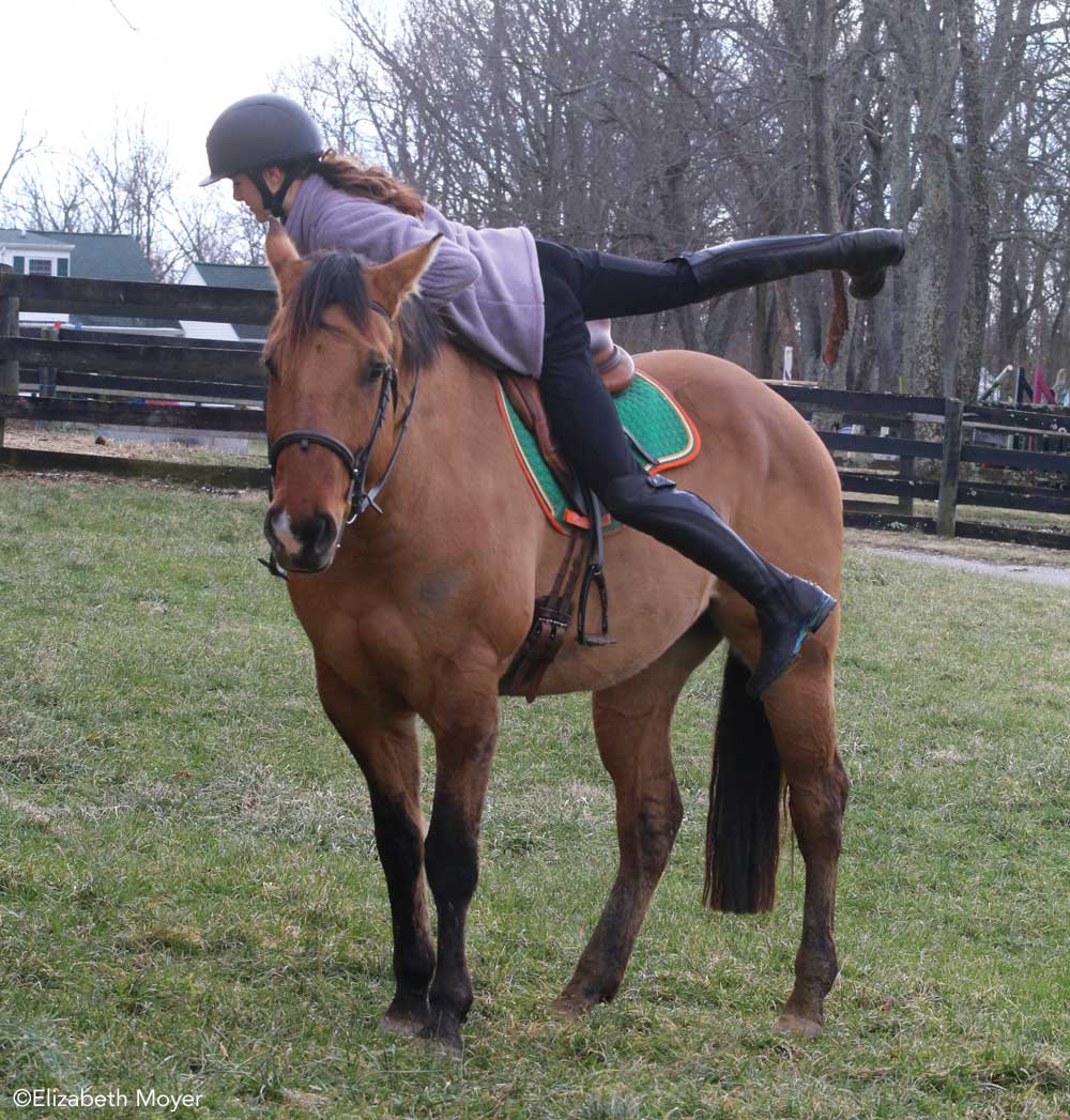 Rider dismounting a horse